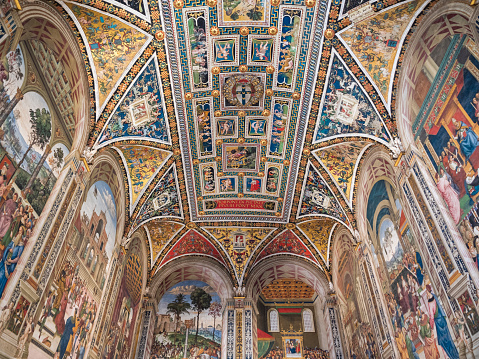 Siena, Italy - August 15 2021: Piccolomini Library Vault Ceiling Interior in Siena Cathedral with Frescoes by Pinturicchio