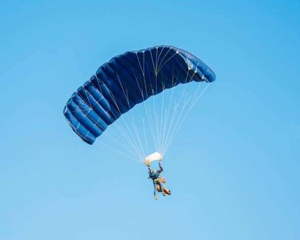 istock Skydiver activity sport jump on the blue sky background 1345551015