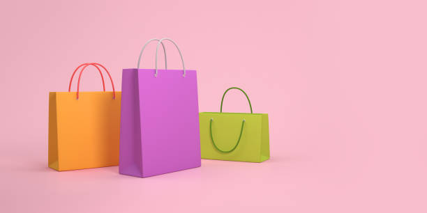 istock 3D paper bags on a pink background 1345551083