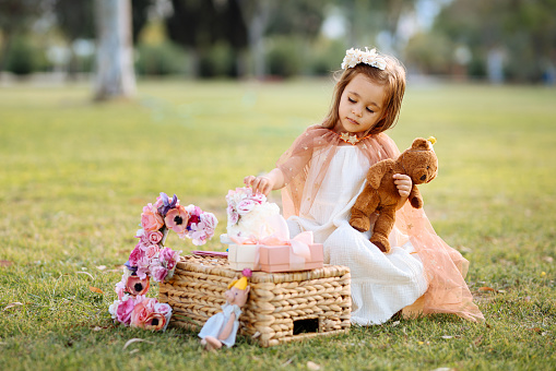 Portrait of cute toddler girl with teddy bear