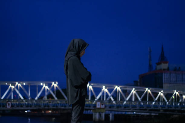 istock Young Asian Hijab standing enjoyment at night 1345554545