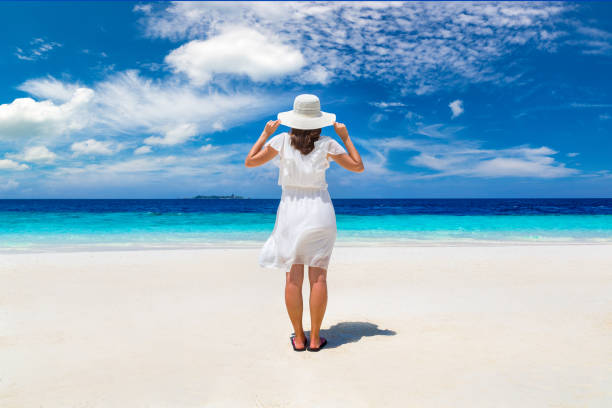 istock Woman stand at  beach 1345556652