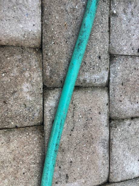 istock Green garden hose 1345557718