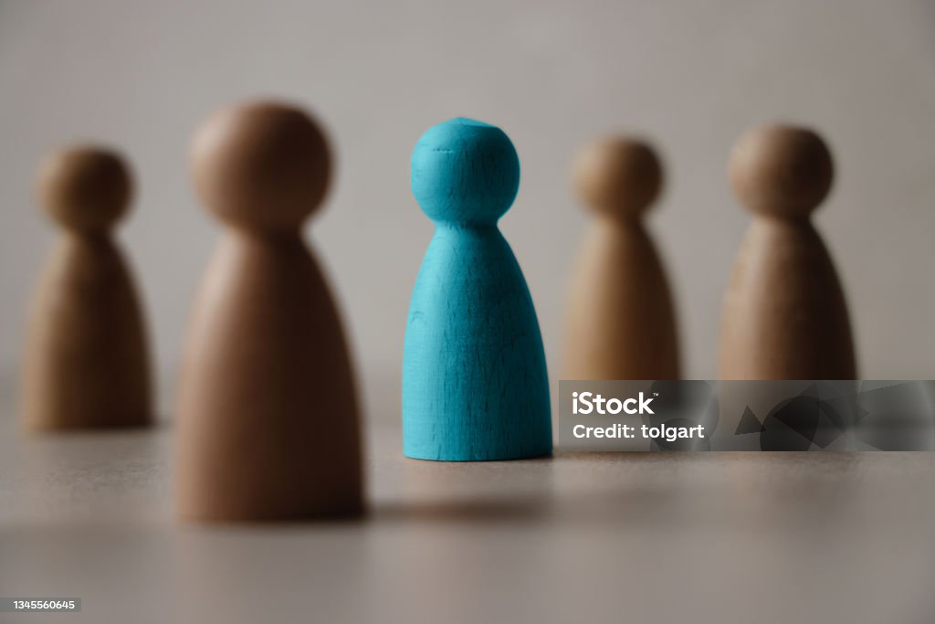 Wooden figures on a table Group of wooden people. Business concept Privacy Stock Photo
