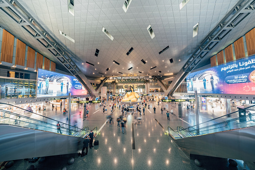 Passengers walk through Hamad International Airport in Doha, Qatar (June 2021).