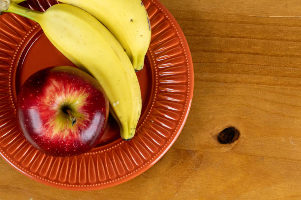 istock beautiful and tasty apple and banana 1345562019