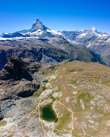 Aerial view of beautiful and world famous Matterhorn mountain on a blue sky day, Switzerland. High Resolution shot