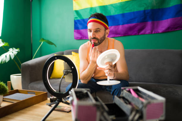 istock Gay influencer using beauty products 1345562760