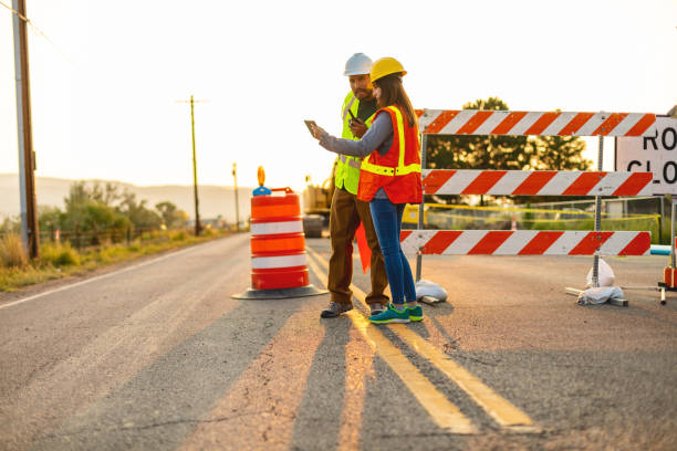 Digital Tablet Communication in the Field Hispanic Workers Setting Barriers and Directing Traffic Street Road and Highway Construction Photo Series