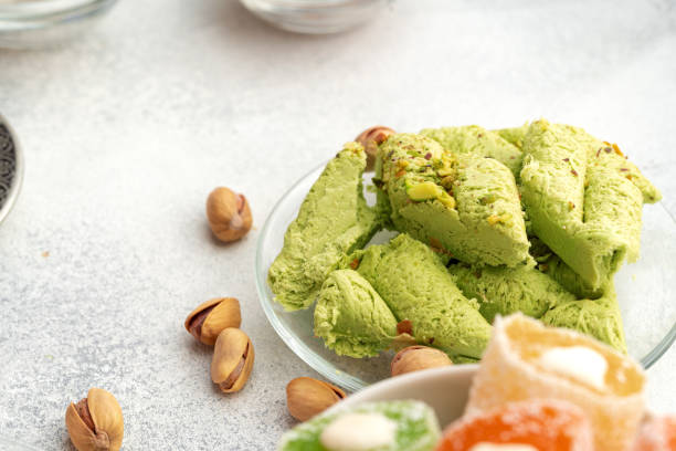 istock Close up of colorful Turkish halva sweets on gray surface 1345564930