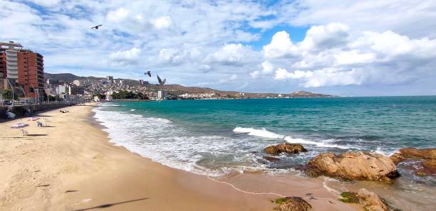 istock Panoramic view of sea and buildings against sky 1345567938