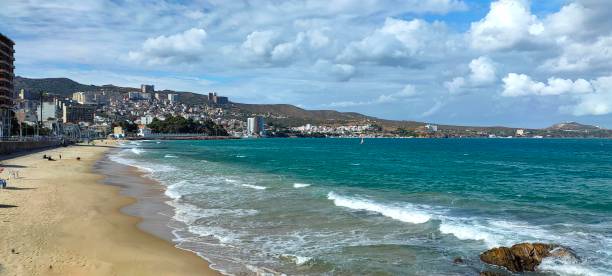 istock Panoramic view of sea and buildings against sky 1345567944