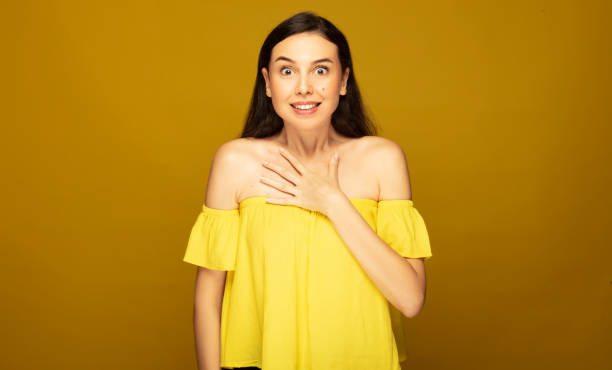 istock Excited beautiful woman with hand on chest. 1345567985