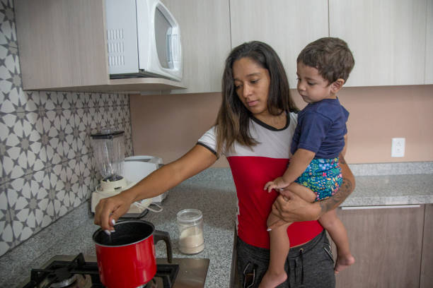istock woman with baby at home 1345569929