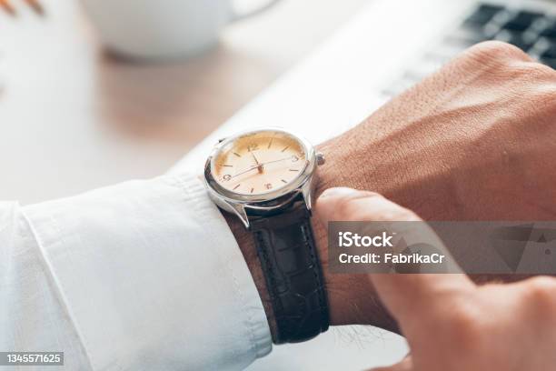 Businessman Checking Time On His Watch Close Up Stock Photo - Download Image Now - Impatient, Business Person, Watching