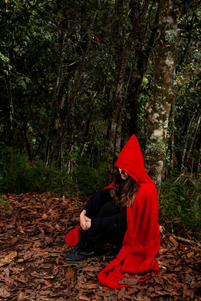 istock Woman dressed in a red cape 1345574180