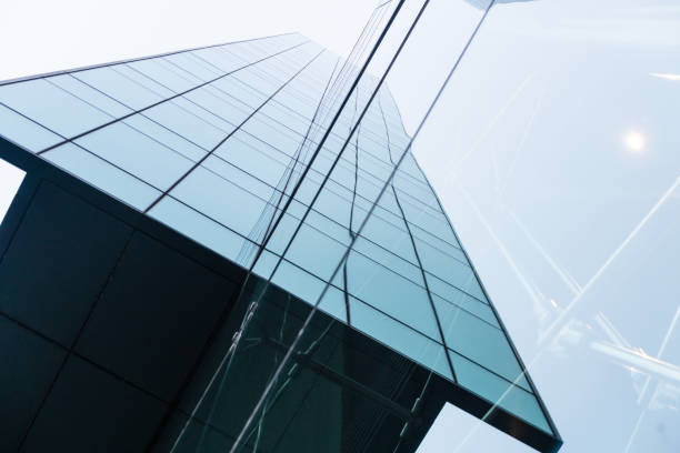istock View of a contemporary glass skyscraper reflecting sky. 1345575129
