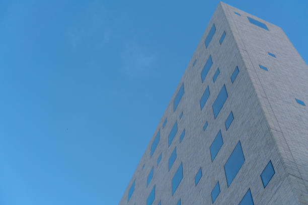 istock Building with few glass windows. 1345575156