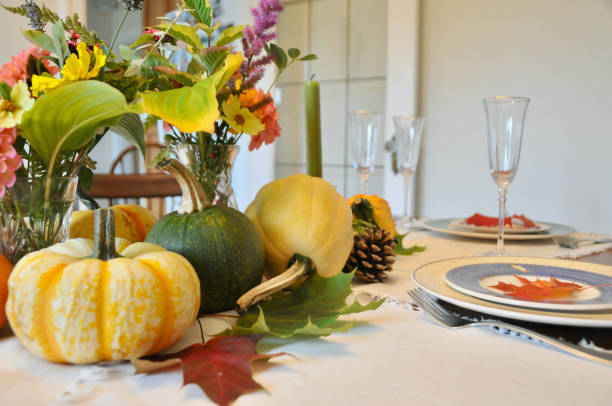 istock Autumn harvest decor on home dining table for family Thanksgiving dinner celebration 1345576754