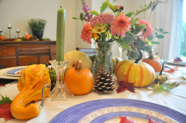istock Autumn harvest decor on home dining table for family Thanksgiving dinner celebration 1345576797