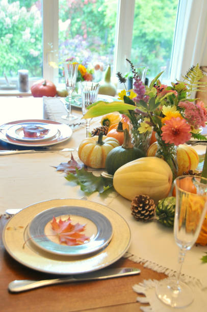 istock Autumn harvest decor on home dining table for family Thanksgiving dinner celebration 1345576811