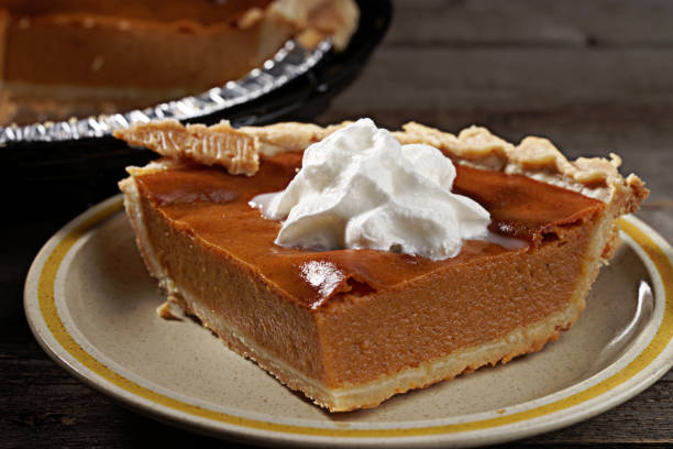 istock Pumpkin Pie Desert on Dark and Moody Background 1345587130