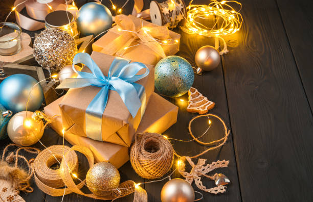 istock Merry Christmas. Gift boxes, Christmas balls and decorations on a dark background 1345587611