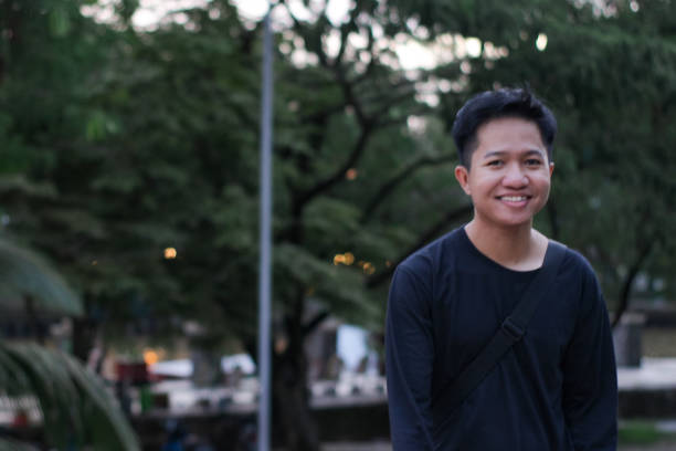 istock Young men walking at city park 1345588379