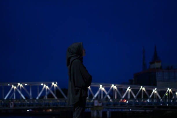 Young Asian Hijab standing enjoyment at night city