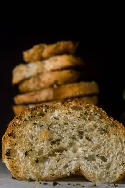 istock toast with oil and oregano on a white board 1345588549