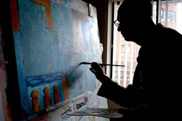 istock Artist painting in home studio 1345588643