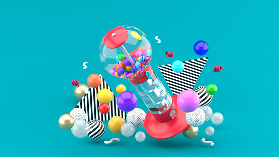 Gum ball machine among colorful balls on a blue background.-3d rendering.