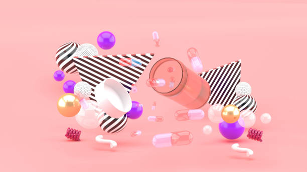 istock Floating medicine bottle surrounded by colorful balls on pink background.-3d rendering. 1345593969