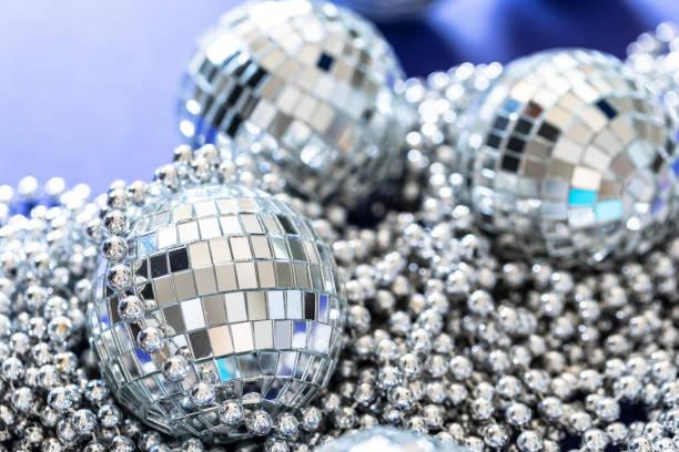 istock Sparkling disco ball in a day light. Concept of party. 1345597078