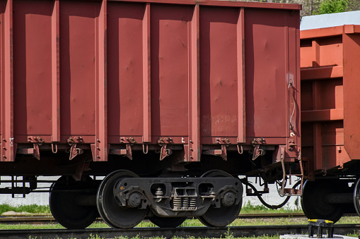 Cargo railroad car on the station tracks