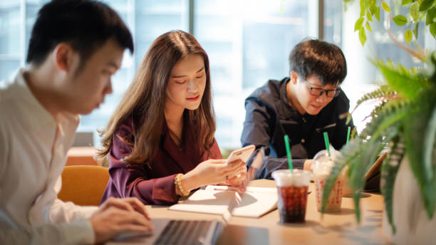 istock Asian colleagues discussing in office meeting room 1345601789