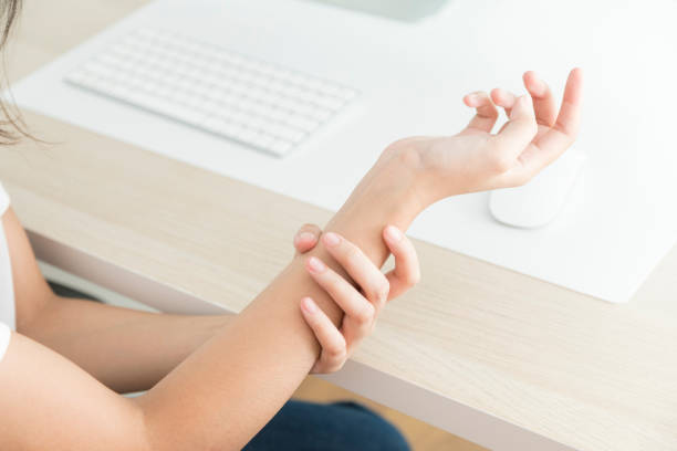 istock Concept of office syndrome, woman having wrist pain from using computer. 1345602865