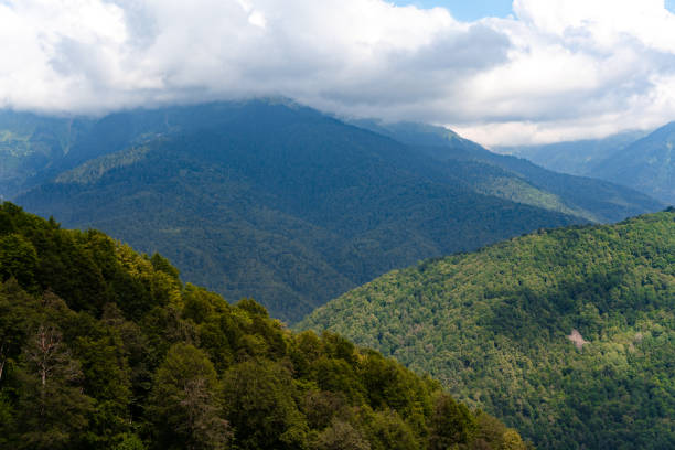 istock Scenic green mountains and beautiful sky clouds for background 1345603660