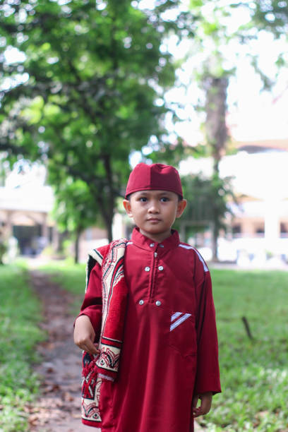 istock Asian Muslim kid at park 1345604389