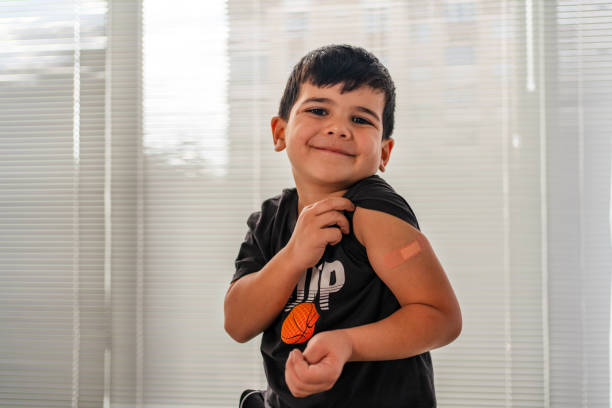 Vaccinated child Showing Shoulder After Shot