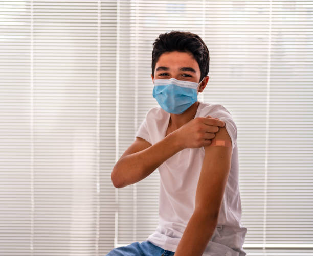 Vaccinated boy Showing Shoulder After Shot stock photo