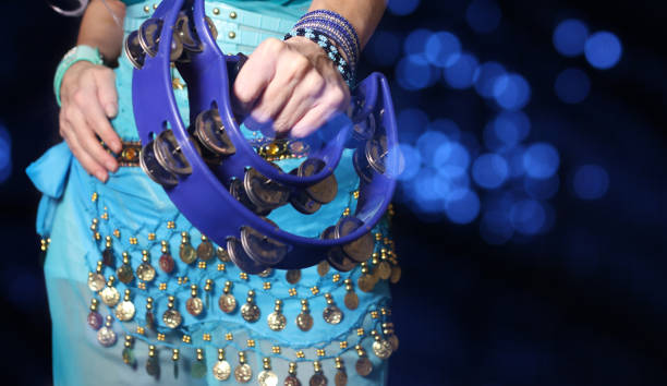 Belly Dancer With Blue Costume Close-up With Tambourine stock photo