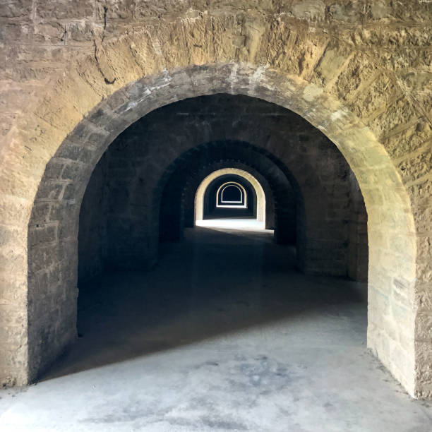 Series of arch  doors in a stone building