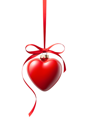 Red Christmas ball with heart shape hanging isolated on white background.