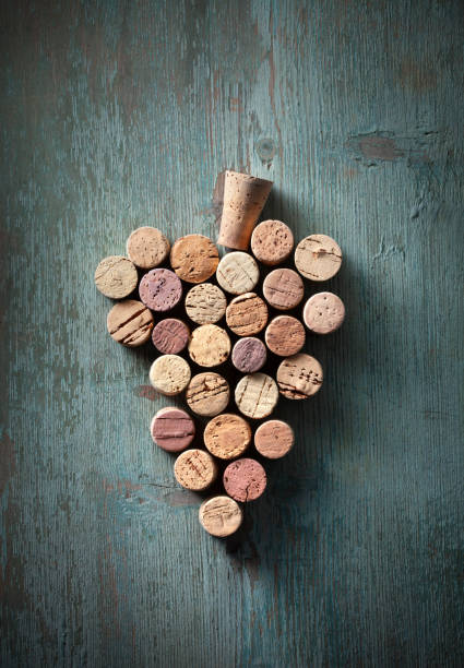 Wine bottle corks in the shape of a bunch of grapes Bunch of grapes shape made with corks. cork stopper stock pictures, royalty-free photos & images