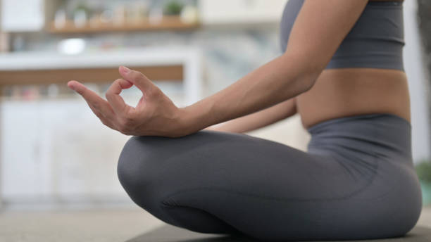 istock Close Up of Female Hands Meditating 1345619358