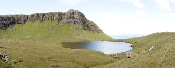 Hvannavatn lake on Suðuroy Island in the Faroe Islands of Denmark. Hvannavatn lake on Suðuroy Island in the Faroe Islands of Denmark. vágar photos stock pictures, royalty-free photos & images