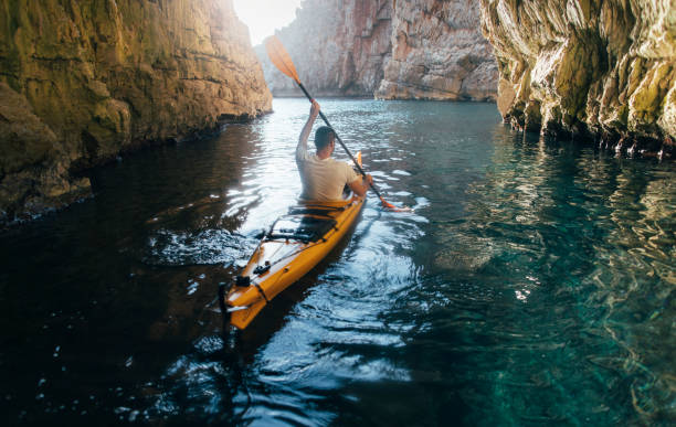 istock Sea kayaking in a narrow canyon 1345628215