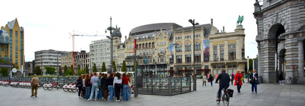 Panorama Koningin Astridplein on a Saturday in Antwerp Antwerp Belgium - October 2, 2021: 20 caucasian teen students gathering on square Queen Astrid near the zoo. houses in antarctica stock pictures, royalty-free photos & images
