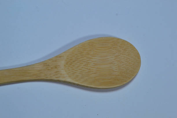 istock A Spoon made of bamboo on a pure white background 1345634791
